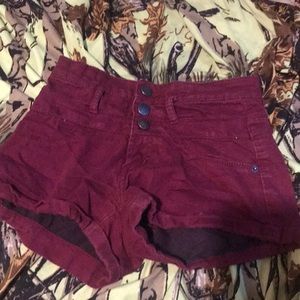 They are redish brown jean shorts 3 girls  form nobo